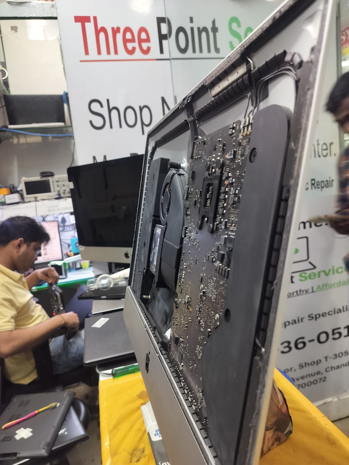iMac opened during internal repair service at the CompSense workshop